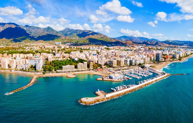 Marbella city port and beach aerial panoramic view